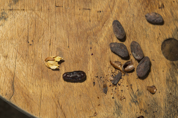 Nuts in shells on wooden table - Fotó, kép