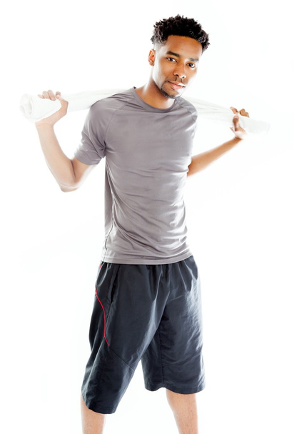 Attractive afro-american man posing in studio - 写真・画像