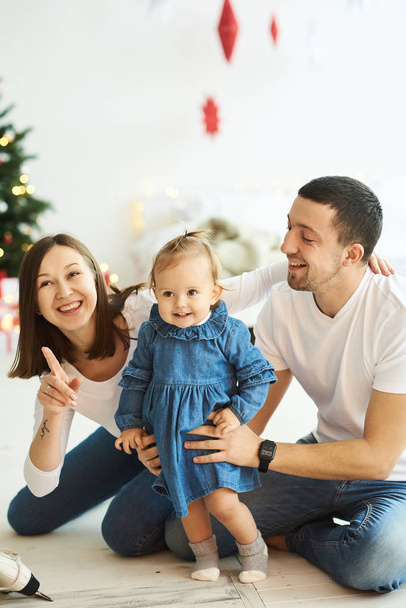 happy family mother father and child on Christmas morning in bed - Фото, изображение
