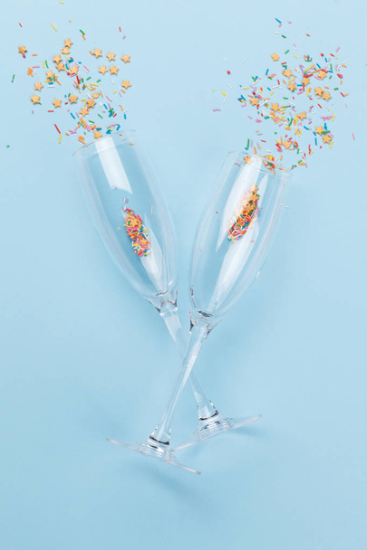 Champagne glasses and colorful sweets holiday - Φωτογραφία, εικόνα
