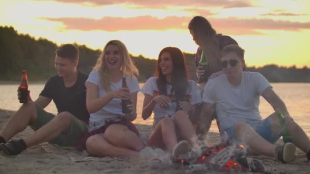 The perfect party around bonfire with orange sky - Footage, Video