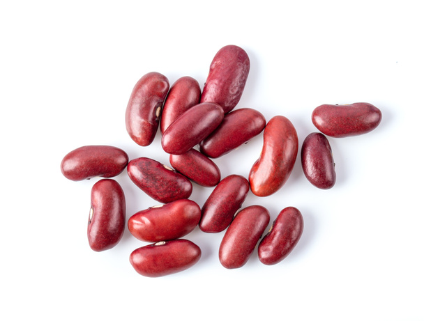 白い背景に赤い豆が孤立していますトップビュー - 写真・画像