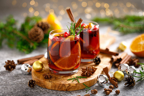 Christmas mulled wine. Traditional Xmas festive drink with decorations and fir tree - Фото, изображение
