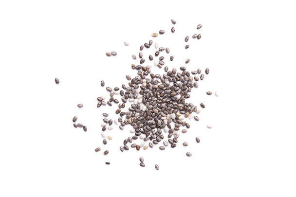 Small heap of chia seeds isolated on white background, healthy superfood. Top view, macro view - Foto, Imagen