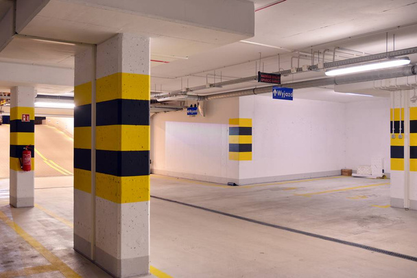 Multi-station underground garage for vehicles. Underground car park. Underground car parking at modern house. - Photo, Image