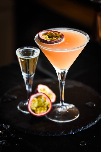 tasty prosseco & passion fruit cocktail with fresh fruits - 写真・画像