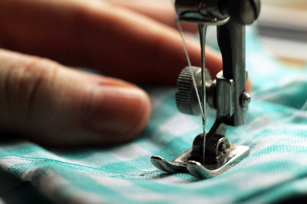 sewing machine and item of clothing, macro - Photo, Image
