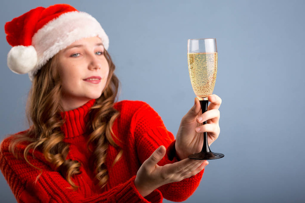 Sexy happy woman with champagne isolated on gray background - Foto, Bild