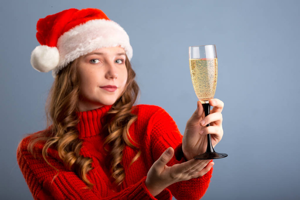 Sexy happy woman with champagne isolated on gray background - Foto, Imagen
