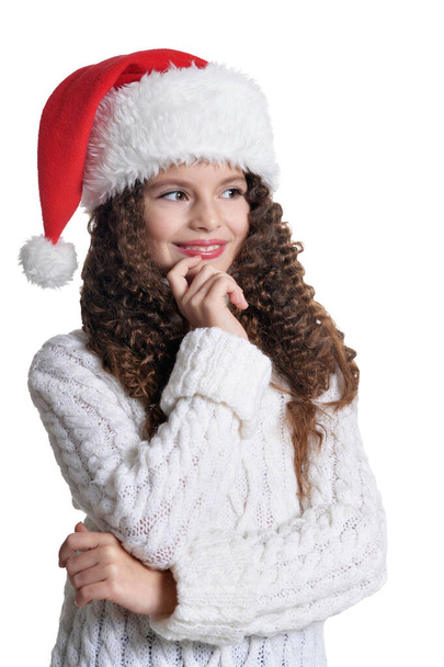 Portrait of smiling little girl in Santa hat  isolated on white background - Photo, Image