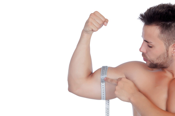 Hombre musculoso con cinta métrica
 - Foto, imagen