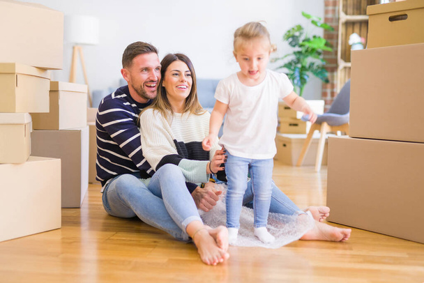 mother, father and little daughter in new flat apartment   - Photo, Image