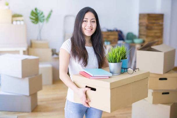 young woman moving to new house - Photo, Image