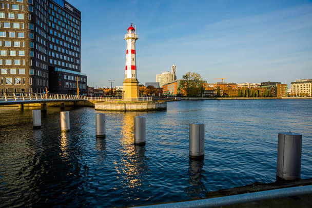 Malmo, Sweden: Beautiful white lighthouse with red stripes. City in Scania county and Oresund region. - Φωτογραφία, εικόνα