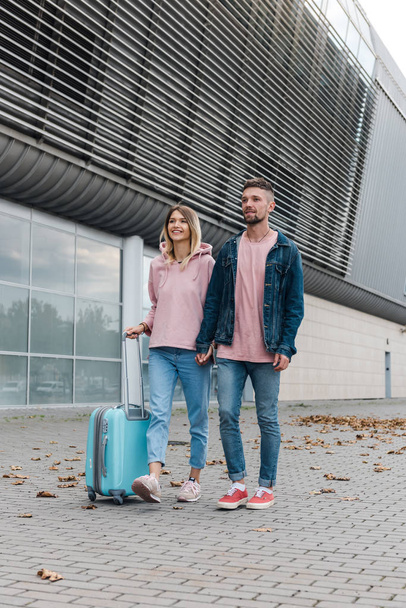 Couple travel with suitcases at the airport. Love with technology concept travel and transportation. - Foto, afbeelding