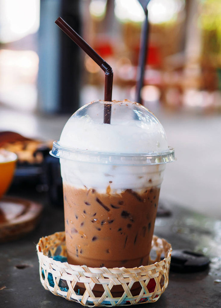 A cup of iced mocha in a tall glass. Ice coffee. - 写真・画像