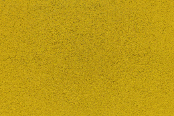 Decorative yellow wall texture of a house - Foto, imagen