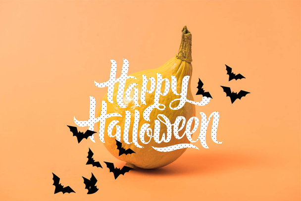 painted yellow Halloween pumpkin on orange colorful background with bats and happy Halloween illustration - Zdjęcie, obraz