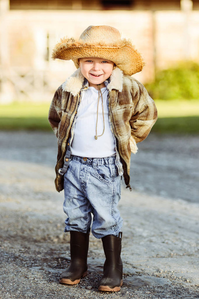 Happy cheerful smiling blond boy on farm - Фото, зображення