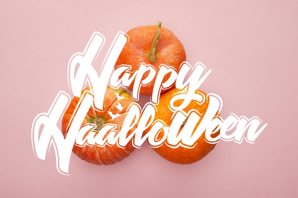 top view of pumpkin on pink background with happy Halloween illustration, Halloween decoration - Valokuva, kuva