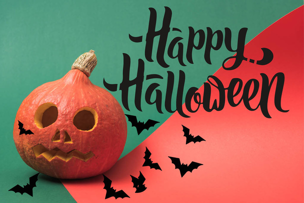 spooky Halloween pumpkin on red and green background with happy Halloween illustration - Photo, image