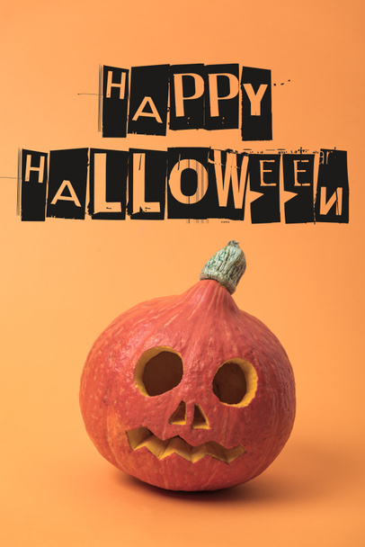 spooky carved Halloween pumpkin on orange background with happy Halloween illustration - Photo, Image