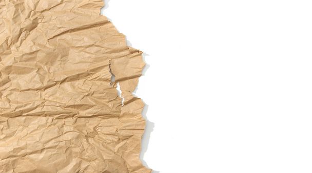 Brown crumpled paper on white background. Copy space for text - Photo, Image