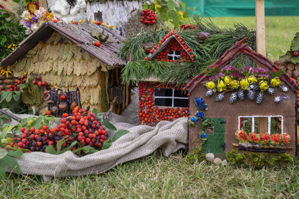 Colorful display of autumn toy cottages in a field - Photo, Image
