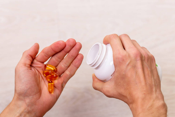 man hand holding drug medicine bottle on Herbal supplement pill,eating healthy - Zdjęcie, obraz