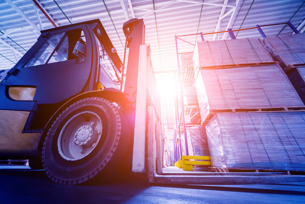 Forklift loader in storage warehouse ship yard, delivery and logistics concept - Фото, зображення