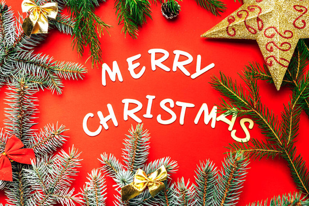 words of Merry christmas on red background. - Foto, afbeelding