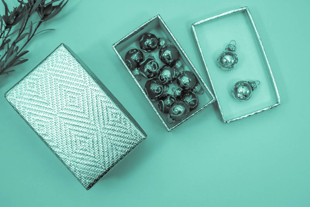 gift box and christmas balls on the table - Фото, изображение