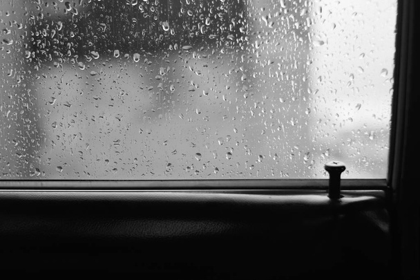 Car glass with drops of rain with copy space - Photo, Image