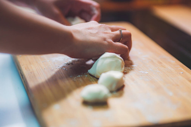 Woman prepare dumpling skin, Making dough  on wooden table - Photo, Image