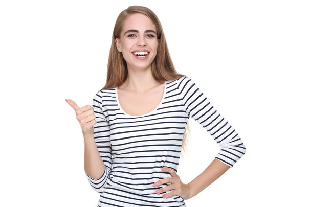 Young beautiful girl showing thumb up on white background - Foto, imagen