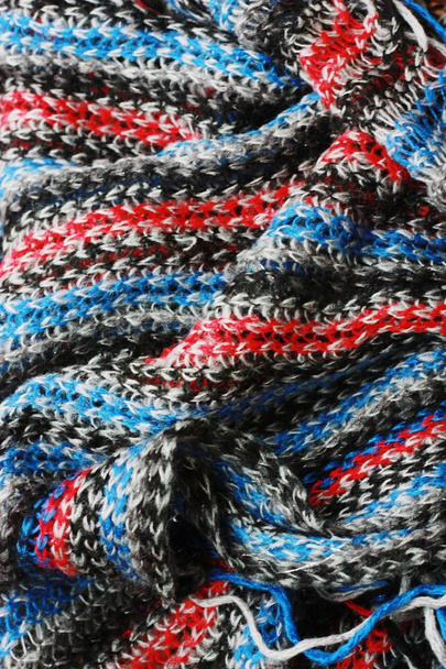 Beautiful blue and red scarf close up view - Photo, Image