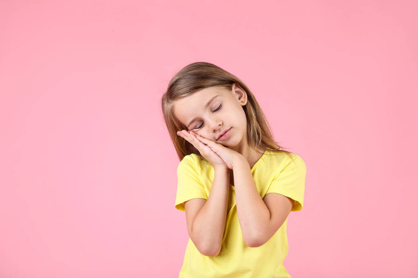 Beautiful little girl on pink background - Foto, Imagen