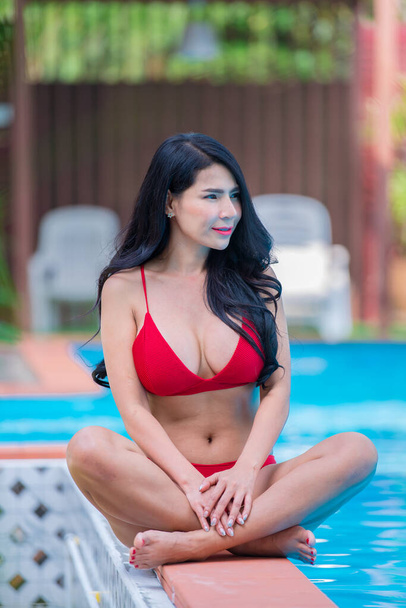 Portrait of asian beautiful woman in bikini at swimming pool,Thailand  - Фото, зображення