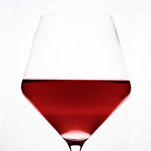 A glass of red wine close-up on a light background. Minimalism. - Fotoğraf, Görsel