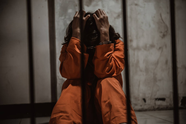 Portrait of women desperate to catch the iron prison, prisoner concept - Фото, изображение