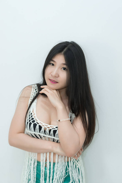 Portrait of sexy asian woman touch her hair on white background - Zdjęcie, obraz