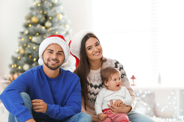 Happy family with cute baby at home. Christmas celebration - Fotoğraf, Görsel
