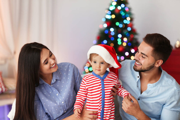 Happy family with cute baby at home. Christmas celebration - Photo, Image