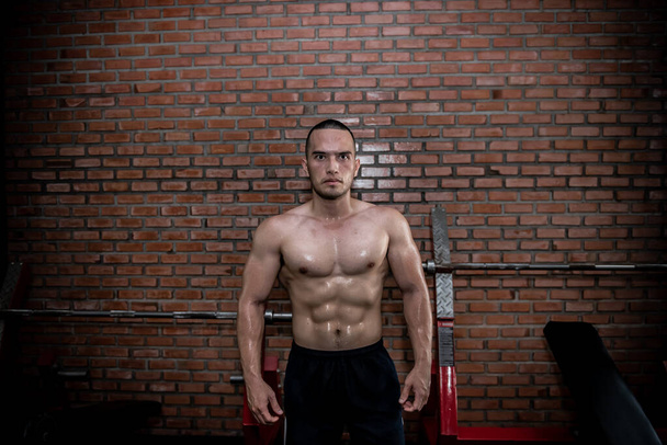 Portrait of asian man big muscle at the gym,Thailand people,Workout for good healthy,Body weight training,Fitness at the gym concept - Photo, image