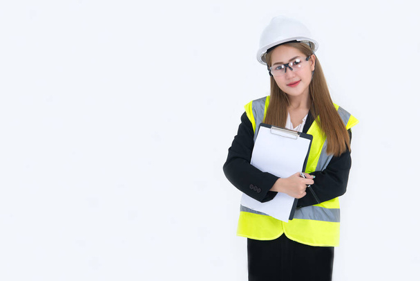 Beautiful asian Engineer woman Wear a suit, glasses and wearing a helmet on white background,Thailand people - Valokuva, kuva