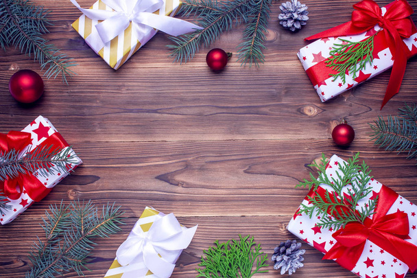 Christmas gifts on wooden table. Top view. Flat lay. Copy space. - 写真・画像