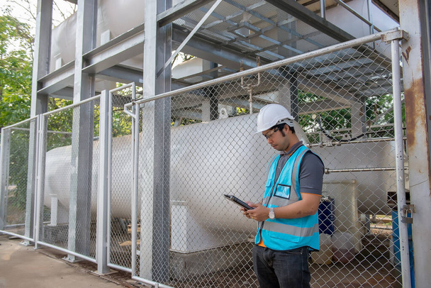 Engineers work place to keep liquid helium,preventive maintenance schedule checking,Thailand people - Φωτογραφία, εικόνα