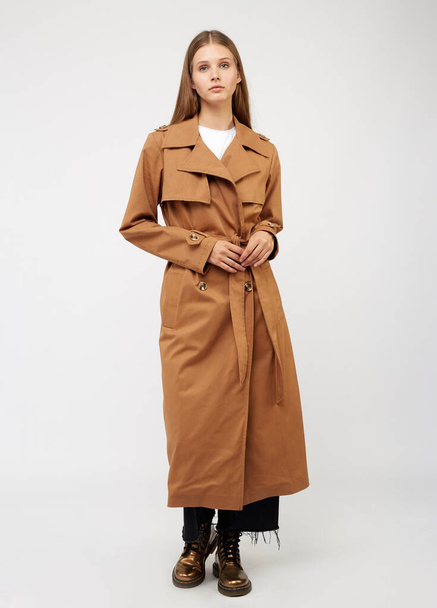 Female trench coat camel color isolated on white background. - Fotó, kép