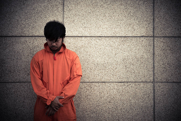 asian man in prison uniform, prisoner concept - 写真・画像