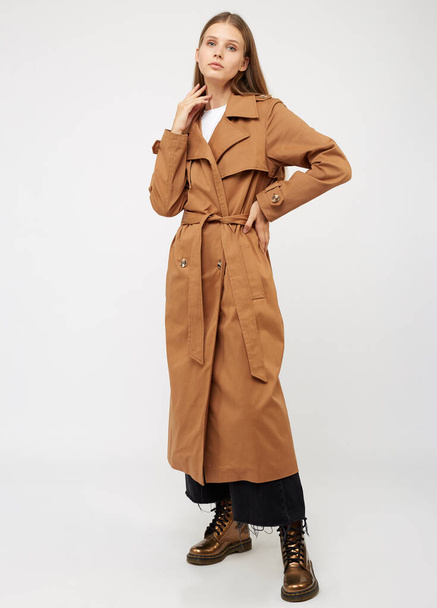 Female trench coat camel color isolated on white background. - 写真・画像